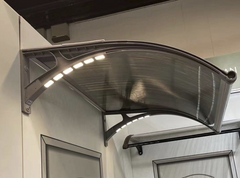 Copertină PREMIUM LUMI cu senzor de lumină și panou solar pentru ușă, 200x100 cm marchiză acoperiș adăpost, gri-transparent